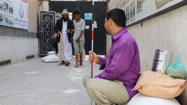 Yemeni society for the careinc Qualifying blind continues to distribute the monthly food basket